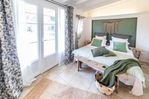 Posteľ alebo postele v izbe v ubytovaní La Bastide du Mûrier