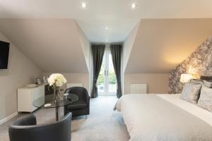 a bedroom with a bed and a table and chairs at 3 Private bedrooms attached to hosts home Free parking in Perth