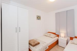 Postel nebo postele na pokoji v ubytování Apartments Viljac
