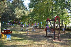 a playground in a park with a string of flags at Marysieńka in Kwatoniów