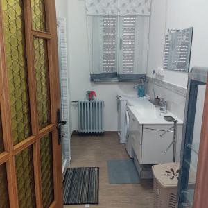 a small kitchen with a sink and a counter at Casa Vacanze Ale e Gio in Piombino
