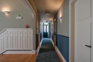 a corridor of a hallway with a door and a hallway at Casa da Marechal - Boutique Hotel by Oporto Collection - Adults Only in Porto