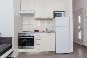 Kuchyň nebo kuchyňský kout v ubytování Apartments Viljac