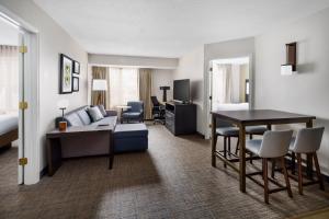 a living room with a couch and a table at Residence Inn Hartford Rocky Hill in Rocky Hill