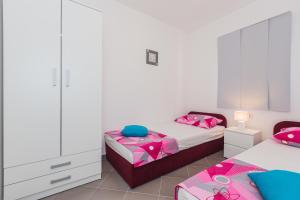 Postel nebo postele na pokoji v ubytování Apartments Viljac