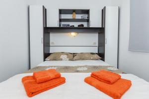 Postel nebo postele na pokoji v ubytování Apartments Viljac