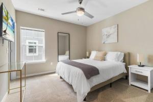 a bedroom with a bed and a window at Elegant 3BR/2BA Condo Near Beaches & Attractions in Melbourne