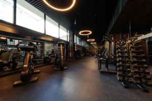 a gym with dumbbells and weights in a room at Radisson Blu Carlton Hotel, Bratislava in Bratislava