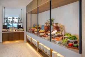 a buffet line with many different types of food at Radisson Beach Resort Palm Jumeirah in Dubai