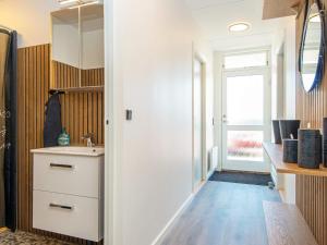 a bathroom with a sink and a window at 2 person holiday home in Ringkøbing in Ringkøbing +35 photos