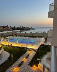 a view of a swimming pool next to the beach at Scandic Rezort in Hurghada