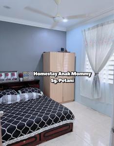 Cama o camas de una habitación en Homestay Anak Mommy