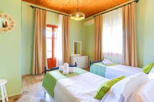 Postel nebo postele na pokoji v ubytování Cochelli Lower Pool Walk to beach WiFi AC + 28 fotografií