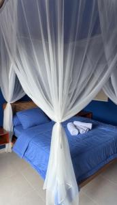 Postel nebo postele na pokoji v ubytování Varmana Ubud Guest House