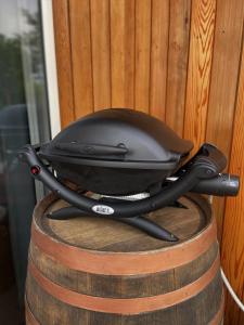a black iron sitting on top of a barrel at Sublime Nooks in Havelock North