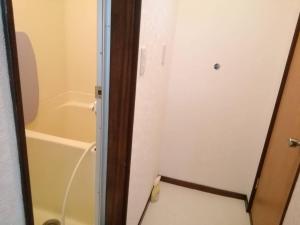 a bathroom with a shower and a toilet and a tub at Corpo Marika 0 in Hakodate