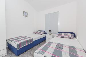 Postel nebo postele na pokoji v ubytování Apartments Viljac