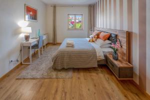 a bedroom with a bed and a table and a desk at Casa do Fotógrafo in Sintra