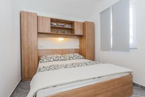 Postel nebo postele na pokoji v ubytování Apartments Viljac