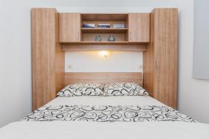 Postel nebo postele na pokoji v ubytování Apartments Viljac