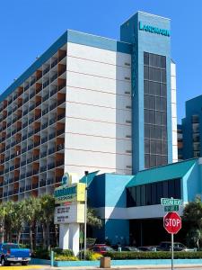 a large hotel building with a stop sign in front of it at Upgraded Studio at Landmark Resort ! 17 pools, lazy rivers, jacuzzis! 814 in Myrtle Beach