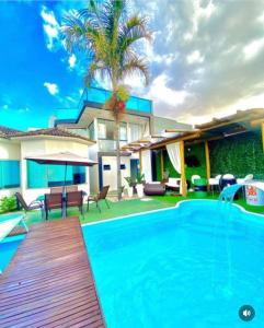 a swimming pool in front of a house at Mansão Digital in Brasilia