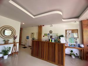 a lobby of a pharmacy with a counter and a mirror at Puyo Suites Homestay in General Luna