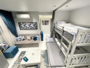 a room with two bunk beds and a couch at Luxury Studio House 589-2 in 6th Of October