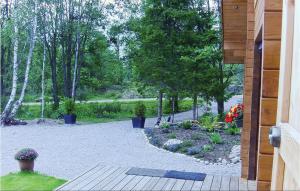 a garden with plants and flowers in a yard at 3 Bedroom Stunning Home In Färgelanda in Muberg +16 photos