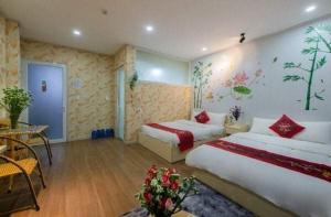 Postel nebo postele na pokoji v ubytování HOTEL NẮNG CHIỀU ĐÀ LẠT