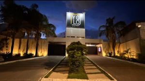 a building with avy sign on the side of it at Yolo Motel in Brasília