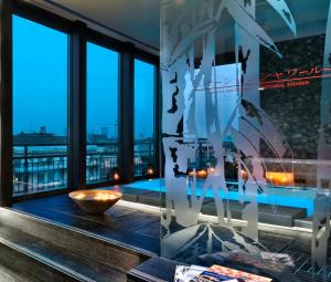 a room with windows and a view of the city at Enterprise Hotel Design & Boutique in Milan