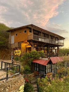 a building with a balcony on the side of it at Akela Gaira Hotel in Santa Marta