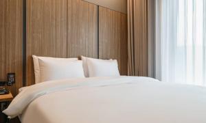 Voodi või voodid majutusasutuse Anseong Nomad Hotel toas