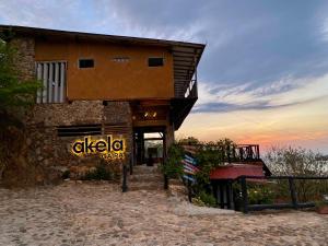 a building with a sign on the side of it at Akela Gaira Hotel in Santa Marta