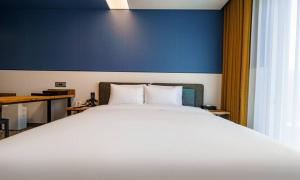 Voodi või voodid majutusasutuse Anseong Nomad Hotel toas