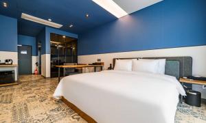 Voodi või voodid majutusasutuse Anseong Nomad Hotel toas