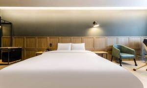 Voodi või voodid majutusasutuse Anseong Nomad Hotel toas