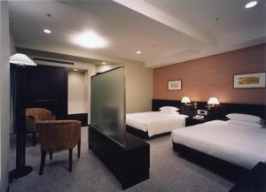 Кровать или кровати в номере Centrair Hotel