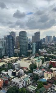a city with tall buildings in a city at MAKATI Isabela Luxury in Manila