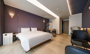 Voodi või voodid majutusasutuse Anseong Nomad Hotel toas