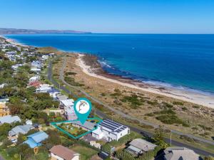 an aerial view of a beach with houses and the ocean at 77 Gold Coast Drive in Carrickalinga