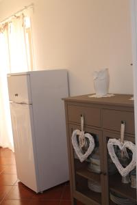 A kitchen or kitchenette at B&B Home Sweet Home Rosolini