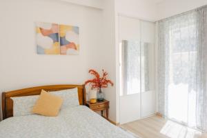 a bedroom with a bed and a window at T&T Homestay in Bègles