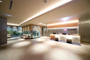 a lobby of a hotel with a reception desk at Travelodge Kyoto Shijo Kawaramachi in Kyoto