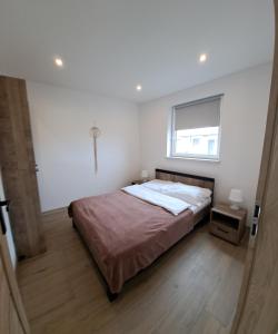 Postel nebo postele na pokoji v ubytování Apartamenty Bursztynowa Zatoka - Łeba - Nowęcin + 67 fotografií