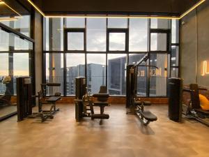 a gym with a view of the city from a building at Millerz Studio 3km to Mid Valley in Kuala Lumpur