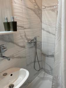 a bathroom with a shower and a sink at Rooms Nikola Rule Ostojic in Međugorje