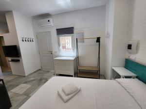 Posteľ alebo postele v izbe v ubytovaní Allo Apartments "Real Escuela" Centro Loft