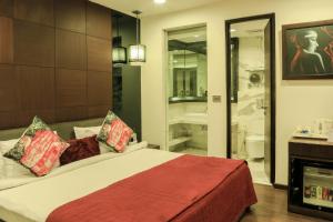 Voodi või voodid majutusasutuse The Nanee Suites toas